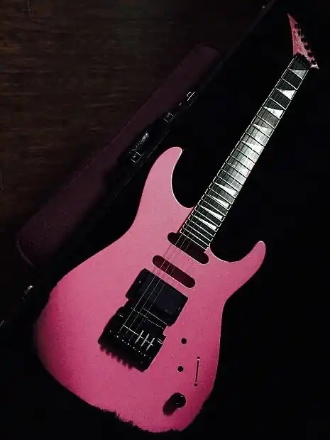 the guitar is finished in an awesome metallic pink.