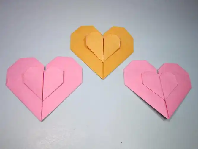一张纸就能折出双爱心简单漂亮的心连心手工折纸教程
