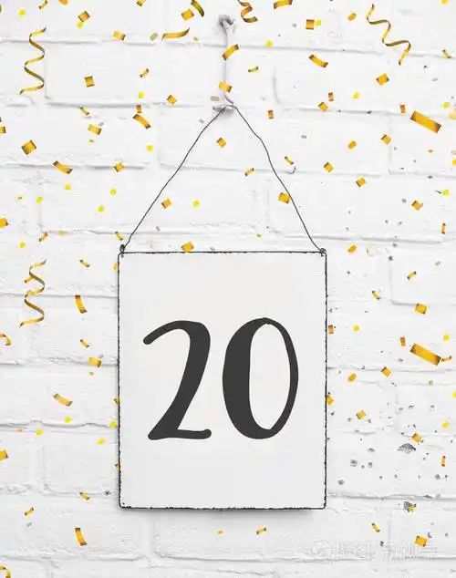 20岁生日派对卡片文字用金色纸屑数字20金属板白砖背景