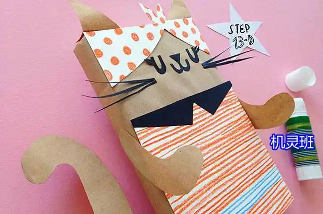 纸盒子废物利用手工制作立体动物玩具:演奏手风琴的猫(步骤图解)