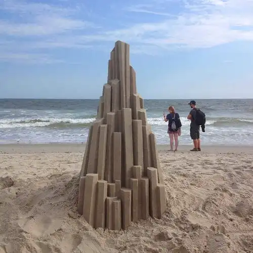 designer sandcastles on a beach in queens