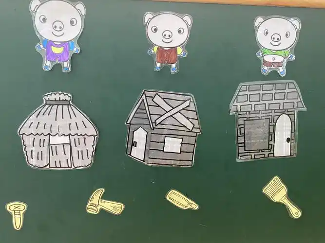 看着图谱念儿歌《三只小猪盖房子》