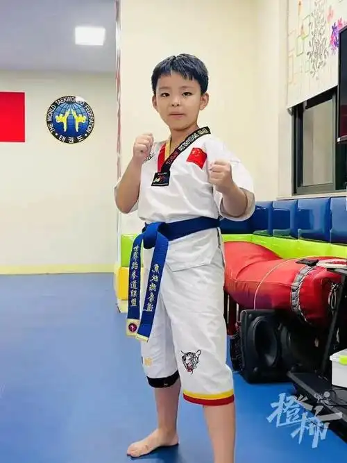 汪孝昀 9岁 城北小学三年级学生 跆拳道"蓝带":"6岁时,我第一次在电视